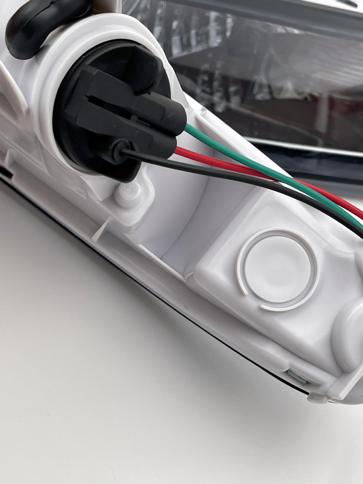 Close-up of smoked front indicator lens for Mazda MX-5 Mk1