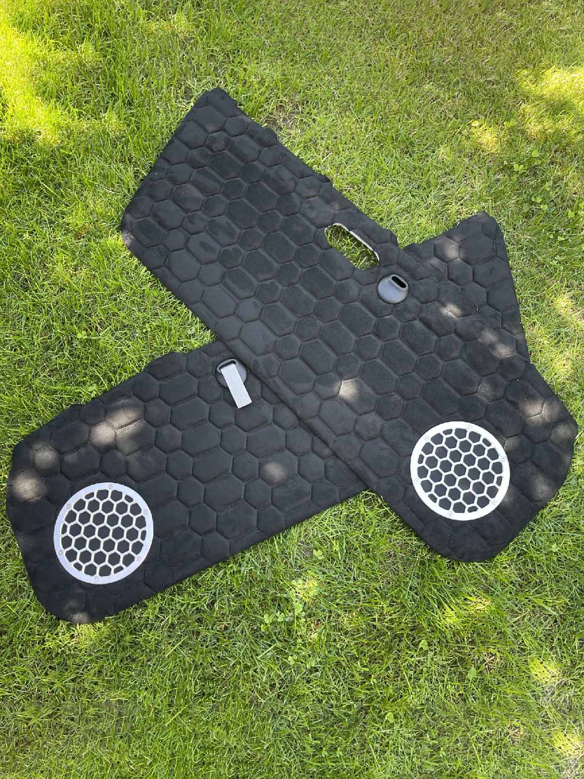 black door cards for miata displayed on grass 