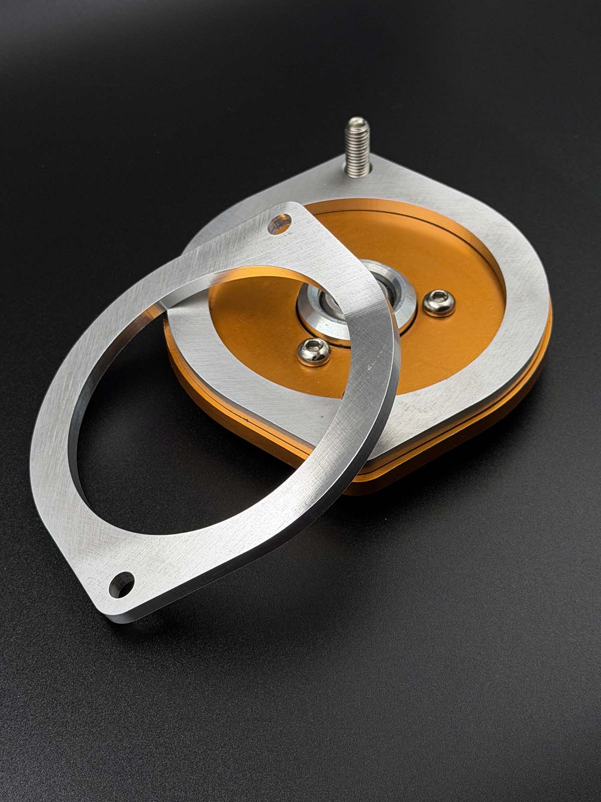 detailed picture of topmount spacer sitting on ohlins topmount