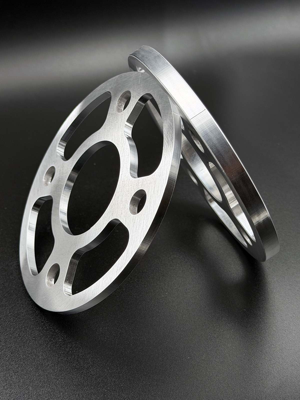 compare view of 5mm next to 10mm thick wheel spacers