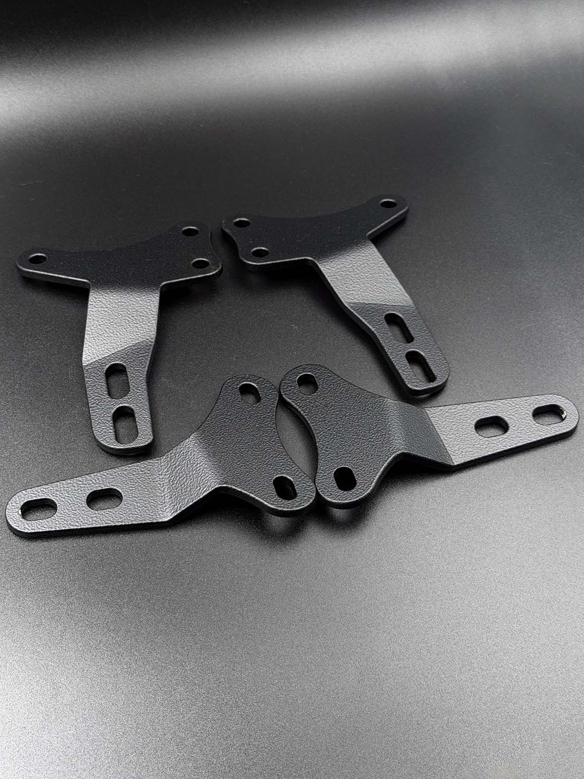 Black hardtop brackets for mazda mx-5 displayed on black background